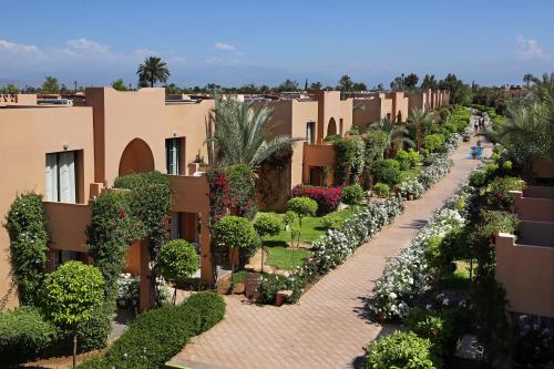 a street in a resort with plants and trees at Valeria Dar Atlas All Inclusive in Marrakech