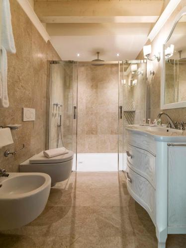 a bathroom with a shower and a sink and a toilet at Hotel Villa Barbarich Venice Mestre in Mestre