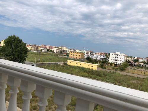 a view of a city from a balcony at Doci Seven Hotel in Velipojë