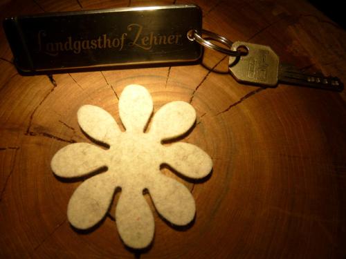 a star cut out on a table with a key at Landgasthof Zehner in Drosendorf