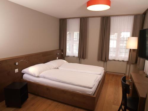 Postel nebo postele na pokoji v ubytování Hotel Bären