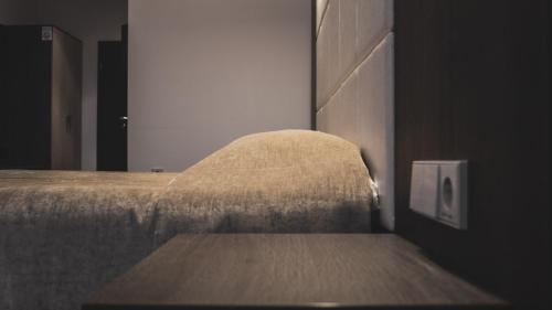 a close up of a bed in a room at Vlantana in Klaipėda