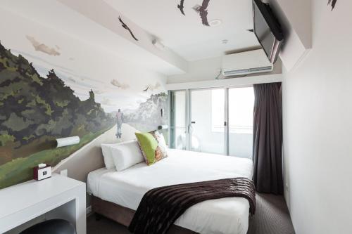 Säng eller sängar i ett rum på Majestic Minima Hotel
