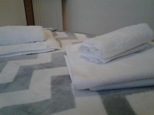 two stacks of towels sitting on a table at Old Tbilisi Flavor for you2 in Tbilisi City