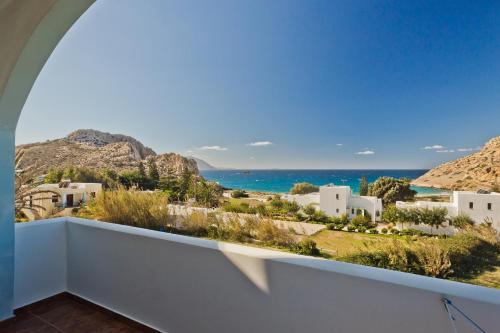 a balcony with a view of the ocean at Montemar Studios & Apartments in Arkasa