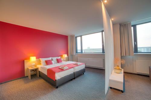 Un pat sau paturi într-o cameră la Biendo Hotel