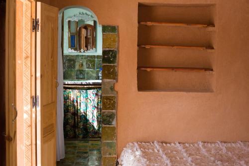 Ecolodge La Palmeraieにあるベッド
