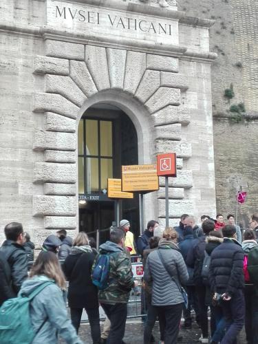 a crowd of people standing outside of a building at Da Adriana al vaticano in Rome