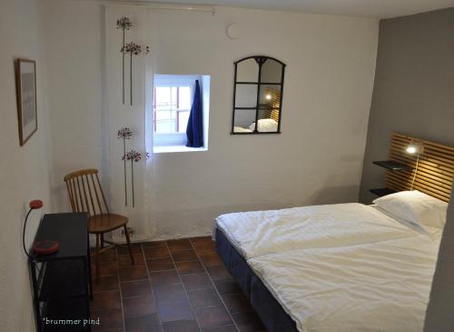 En eller flere senge i et værelse på Hylteberga Gård Bed & Breakfast