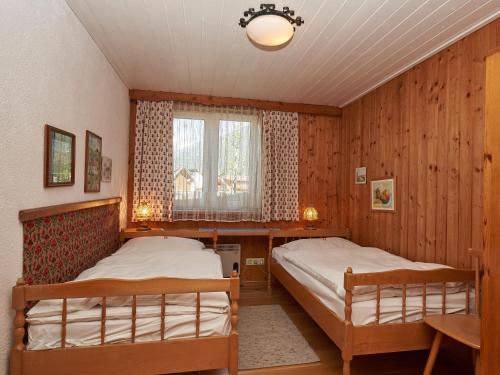 Ένα ή περισσότερα κρεβάτια σε δωμάτιο στο Ferienhäuser Wurian