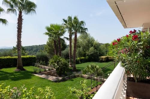a view of a garden from the balcony of a house at TERRE DE REVE in Le Rouret