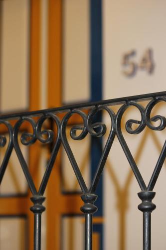a black iron fence in front of a door at Pousada Villa Parahytinga in São Luiz do Paraitinga