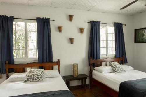 Posteľ alebo postele v izbe v ubytovaní Coffee Mountain Inn