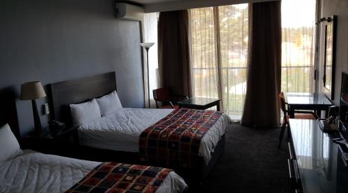 Postel nebo postele na pokoji v ubytování African Sky Ermelo Inn