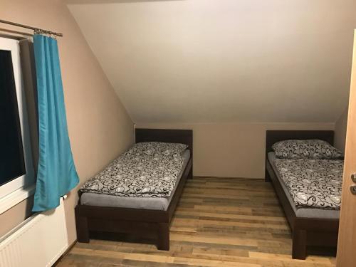 Un pat sau paturi într-o cameră la Vila Pasečná - Lipno