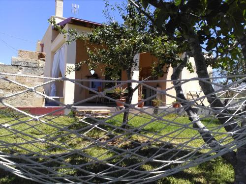 a house with a tree in front of it at Villetta Dote in Casarano
