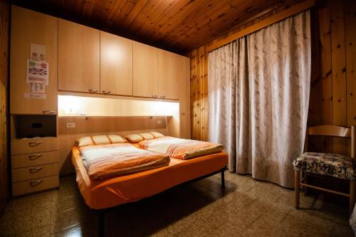 Een bed of bedden in een kamer bij La Bastiana Apartments