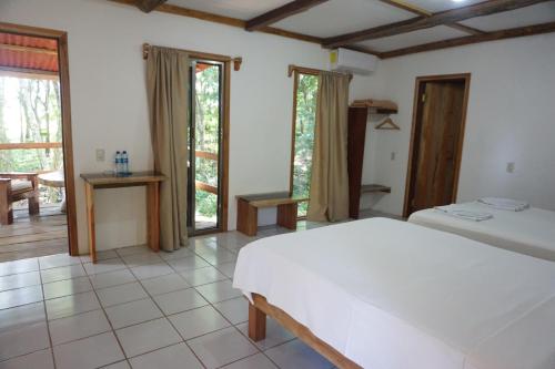 Hotel Cabañas Safariにあるベッド