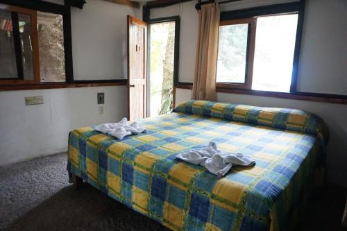 Hotel Cabañas Safariにあるベッド