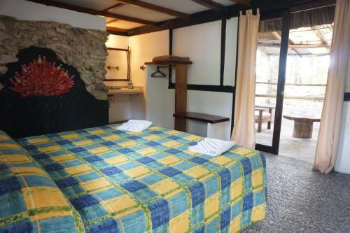 Hotel Cabañas Safariにあるベッド