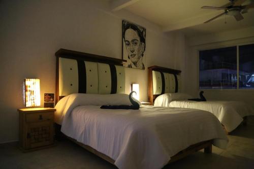En eller flere senge i et værelse på VILLA COSTERA HOTEL BOUTIQUE
