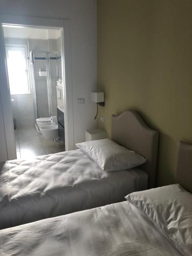 Postel nebo postele na pokoji v ubytování VILLA ZAIRA