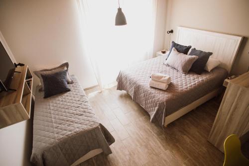 เตียงในห้องที่ Casa Nuestra