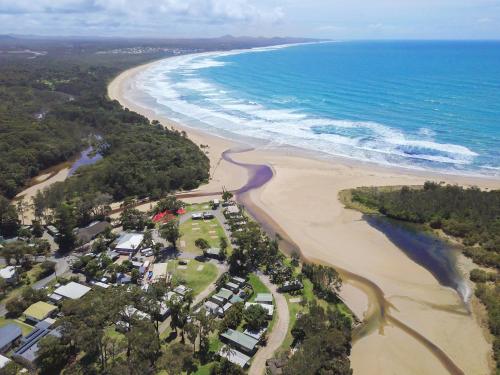 an aerial view of a beach and the ocean at The Beach Arrawarra in Arrawarra