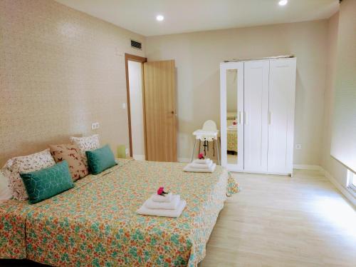 Giường trong phòng chung tại Apartamento centro san blas 36, próximo al Pilar