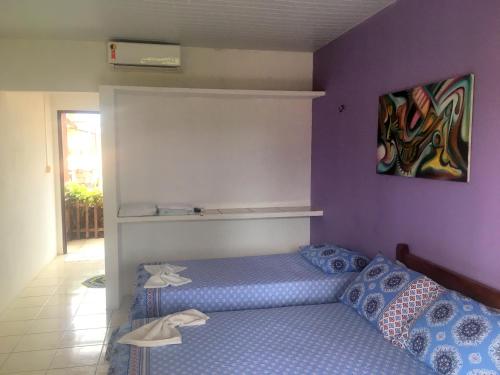 Cama o camas de una habitación en Pousada Brilho da Lua