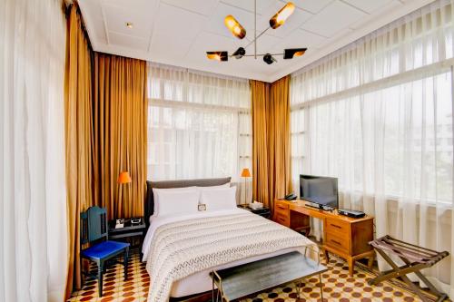 Tempat tidur dalam kamar di The Henry Hotel Manila