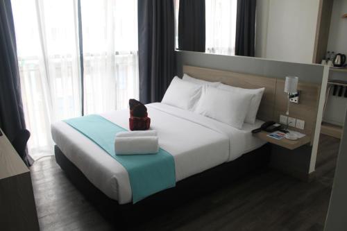Cama o camas de una habitación en Singgah Kertih