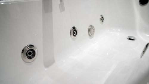 a white bath tub with silver faucets at The Pebley Inn in Chesterfield