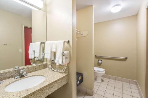 a bathroom with a sink and a toilet at Econo Lodge Inn & Suites I-35 at Shawnee Mission in Overland Park