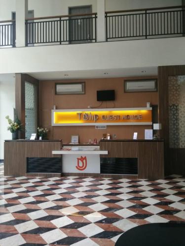 Tulip Guest Houseに飾ってある許可証、賞状、看板またはその他の書類