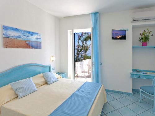 מיטה או מיטות בחדר ב-Hotel Villa D'Orta