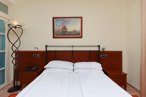 Ein Bett oder Betten in einem Zimmer der Unterkunft Hotel Splendido
