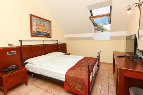 Ein Bett oder Betten in einem Zimmer der Unterkunft Hotel Splendido