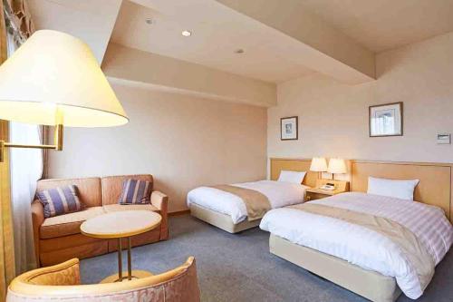 Ένα ή περισσότερα κρεβάτια σε δωμάτιο στο Business Hotel Noda