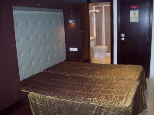 En eller flere senge i et værelse på Residência S. Francisco