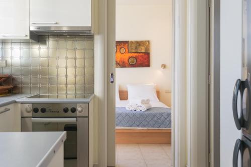 Postel nebo postele na pokoji v ubytování il porto di Milos
