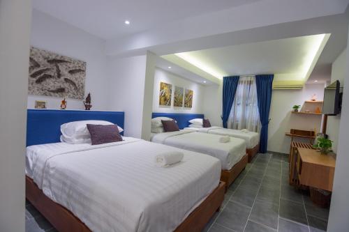 Un ou plusieurs lits dans un hébergement de l'établissement Neth Socheata Hotel