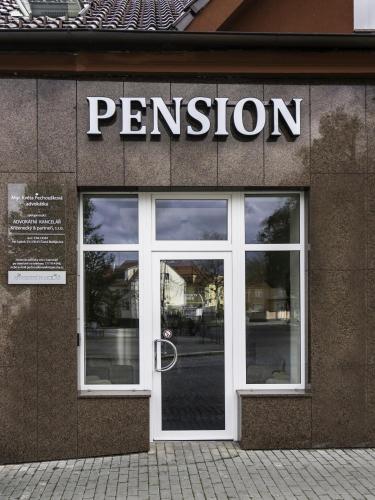 a entrance to a store with a sign on the door at Penzion Park in Vodňany
