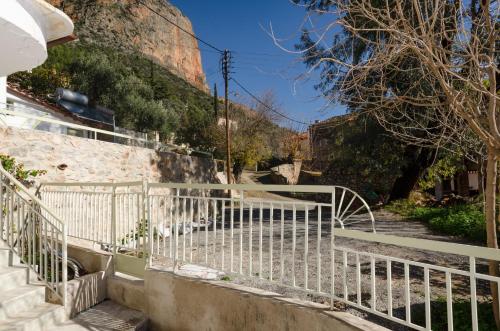 a set of stairs leading up to a building at Ev Zin Basilicum in Leonidion