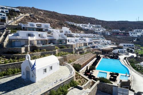 an aerial view of a village with a pool and buildings at Myconian Villa Collection - Preferred Hotels & Resorts in Elia Beach
