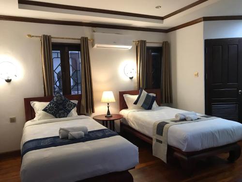 Postel nebo postele na pokoji v ubytování wisdom mystery Hotel