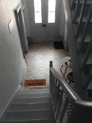 a stairway with a box in the middle of a room at LA MONGEARDIERE in Ay