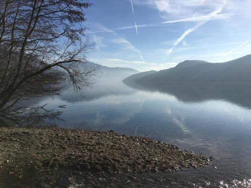 a view of a body of water with mountains in the background at Ferienwohnung Konzept Schmiede in Seeboden