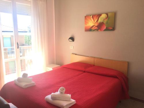 Letto o letti in una camera di Hotel Ausonia B&B RiMiNi