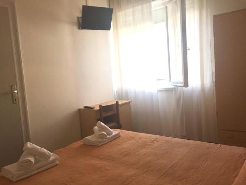Letto o letti in una camera di Hotel Ausonia B&B RiMiNi